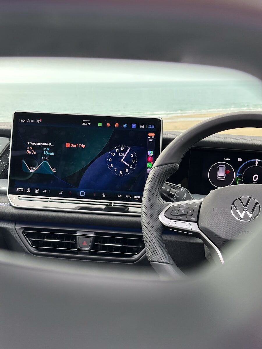 Modern car dashboard with digital display and steering wheel